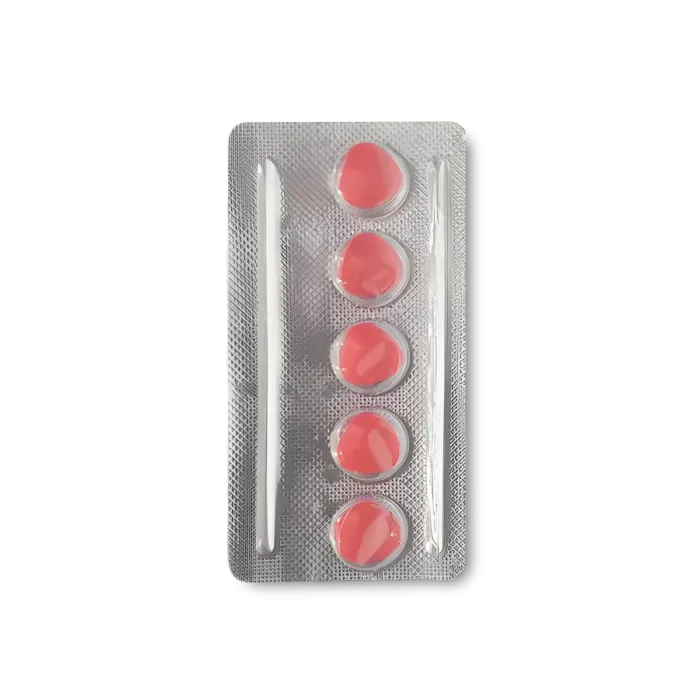 Blister pack of red pills on a white background